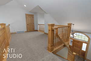 Additional living space featuring vaulted ceiling, carpet floors, and recessed lighting