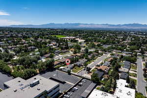 Aerial perspective of suburban area featuring a mountain backdrop