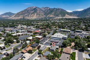 Aerial view of property and surrounding area with mountains