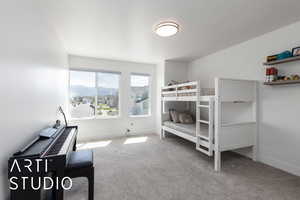 Carpeted bedroom with baseboards