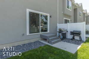 View of patio featuring a grill