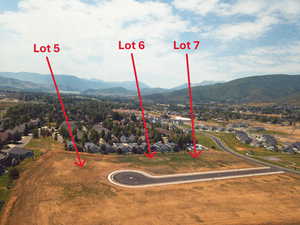 Aerial perspective of suburban area with a mountainous background