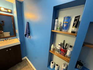 Bathroom with vanity and tile patterned flooring