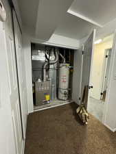 Utilities with heating unit and strapped water heater