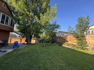 Fenced backyard featuring a patio area