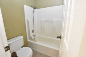 Full bathroom featuring tile patterned floors and  shower combination