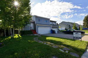 Traditional home with a garage and driveway