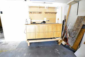 Bar featuring unfinished concrete floors