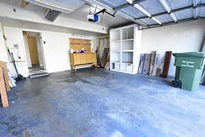 Garage featuring a garage door opener