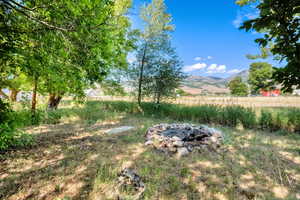 View of yard with a mountain view and a rural view