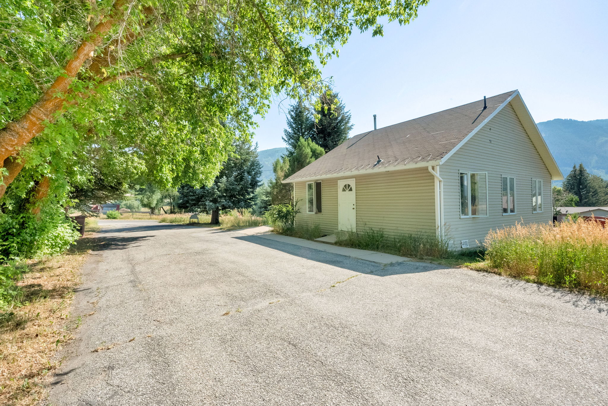 View of side of property with a mountain view