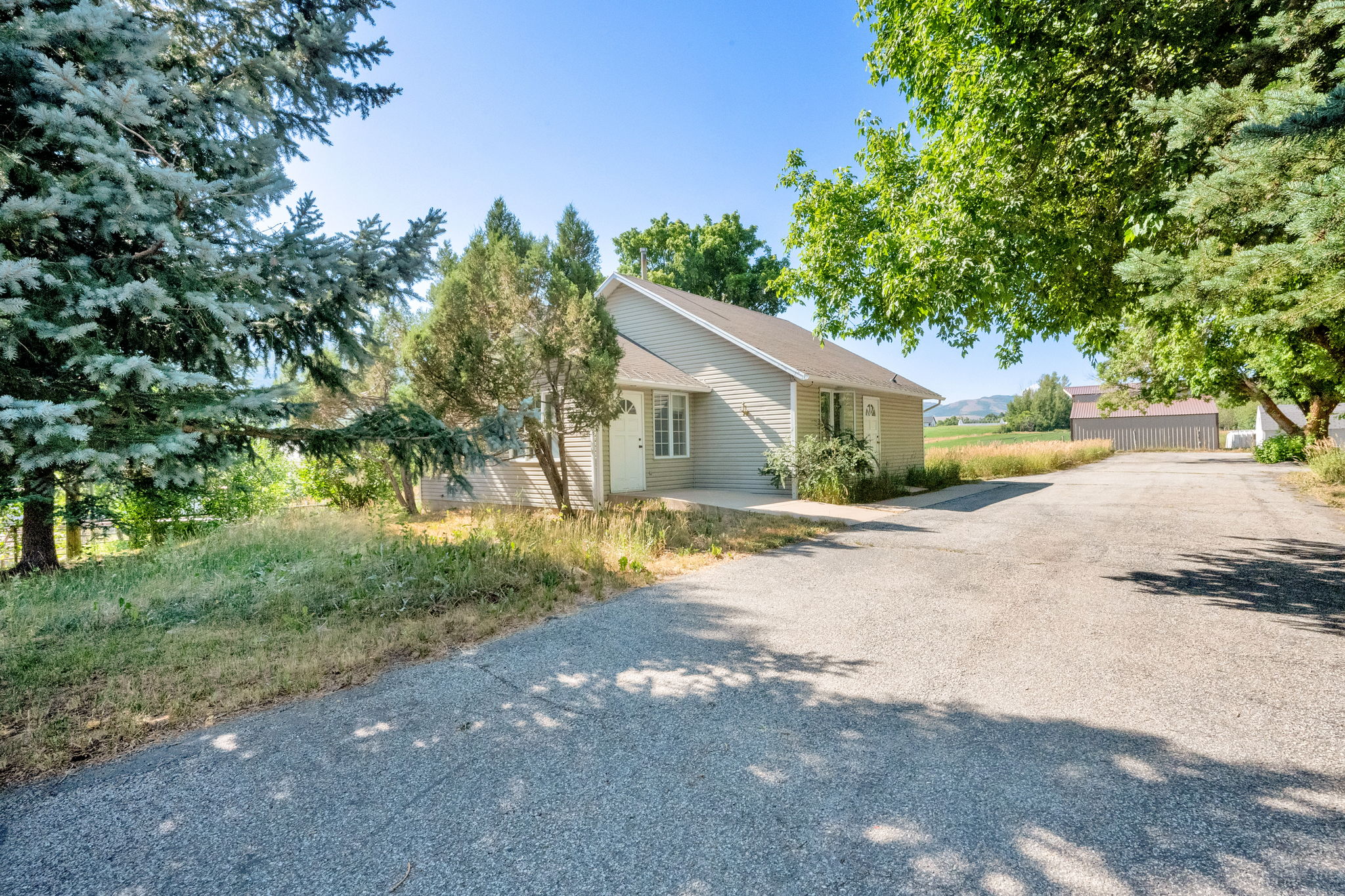 View of property exterior with driveway