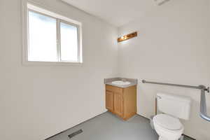 Bathroom with toilet and vanity