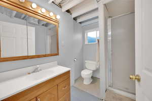 Bathroom featuring vanity and a stall shower
