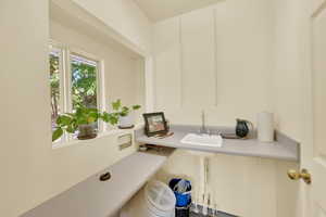 Laundry room with a sink