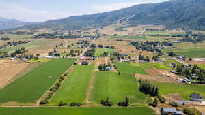 Overview of rural landscape with a mountain backdrop