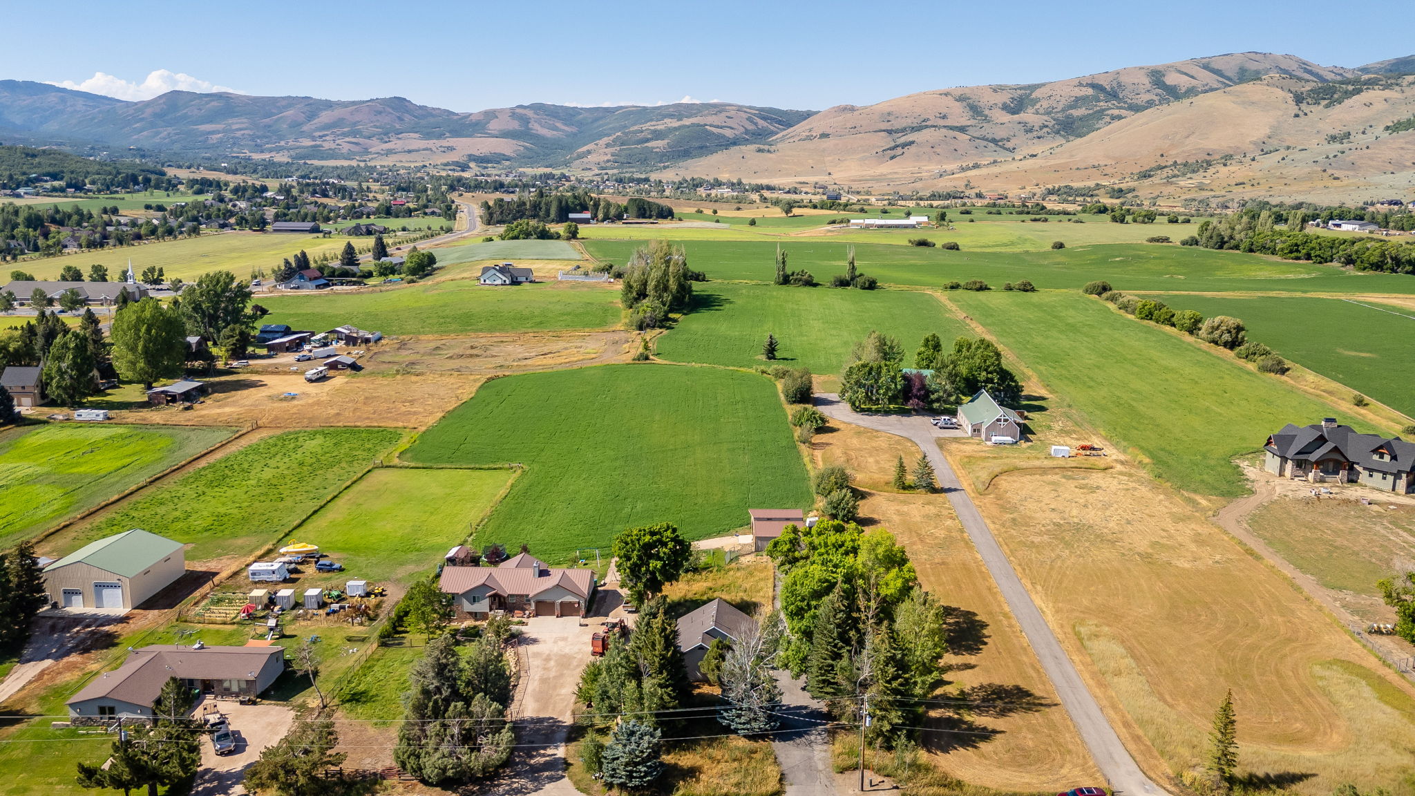 Aerial view of sparsely populated area with a mountainous background
