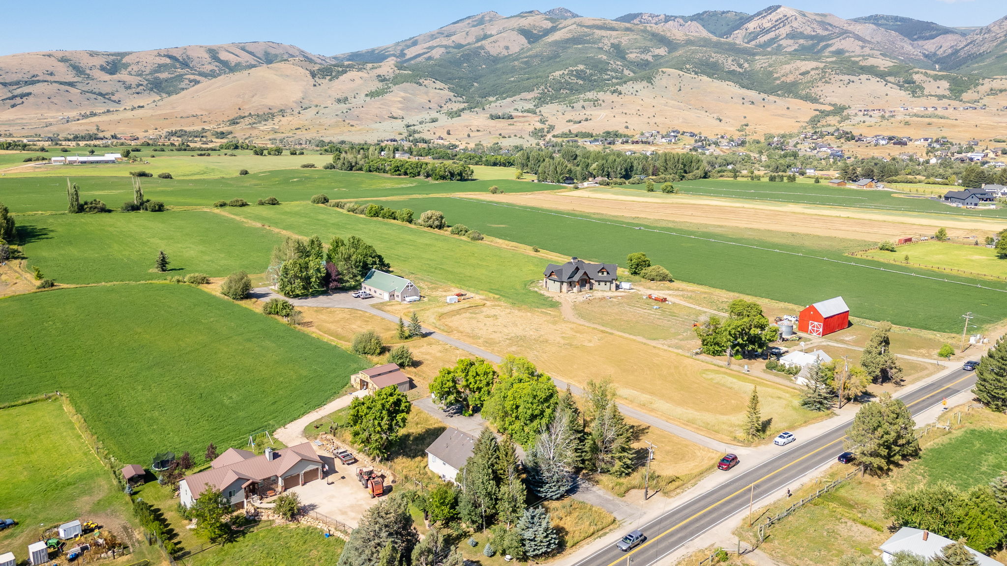 Aerial view of sparsely populated area featuring a mountainous background