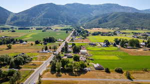 View of mountain background featuring rural landscape
