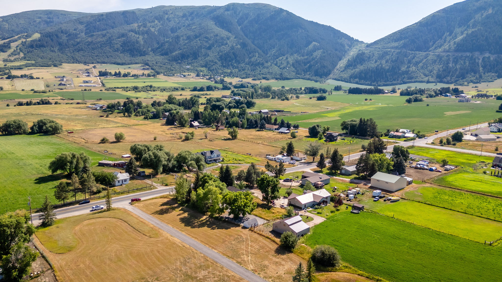 Overview of rural landscape with a mountainous background and agricultural land
