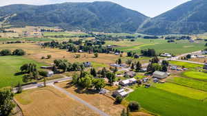 Overview of rural landscape with a mountainous background and agricultural land