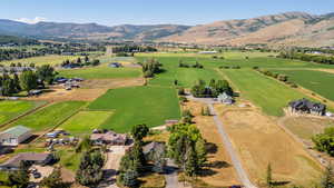 Overview of rural landscape featuring a mountainous background
