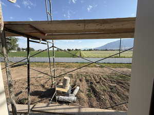 View of yard featuring a view of rural / pastoral area and a mountain view
