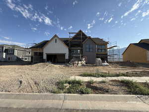 View of front of house featuring board and batten siding