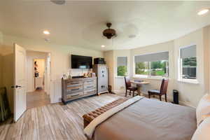 Bedroom with recessed lighting, ceiling fan, and light wood finished floors