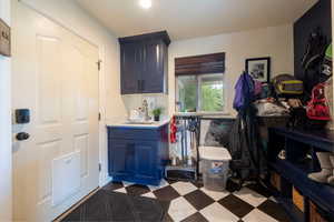 Washroom with a sink and dark floors
