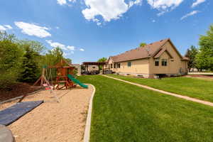 View of play area with a yard