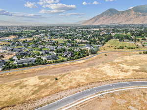 Aerial perspective of suburban area featuring a mountainous background