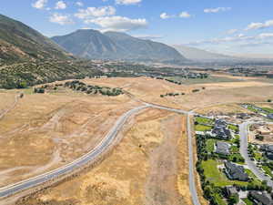 Aerial view of property's location featuring mountains