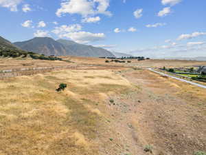 View of mountain background featuring rural landscape
