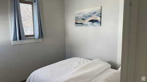 Bedroom with multiple windows