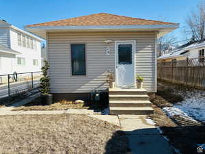 Property entrance with roof with shingles