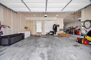 2-Car Garage featuring a workshop area