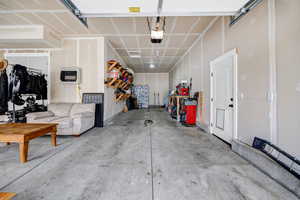 2-Car Tandem Garage featuring heating unit and a garage door opener