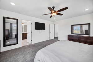 Bedroom with carpet floors, recessed lighting, ensuite bathroom, and ceiling fan
