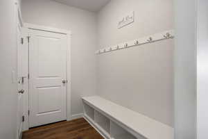 Mudroom featuring dark wood-style floors