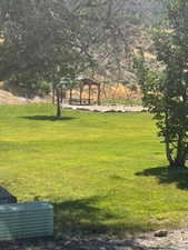 View of community featuring a yard and a gazebo