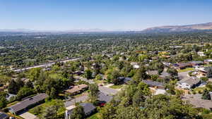 Aerial perspective of suburban area featuring a mountain backdrop