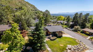Aerial perspective of suburban area with a mountain backdrop