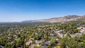 Aerial perspective of suburban area with a mountainous background