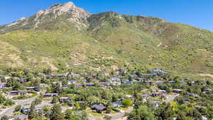 View of property location featuring nearby suburban area and mountains