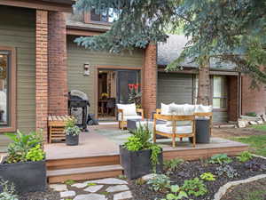Deck featuring a grill and an outdoor living space