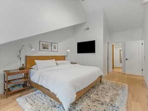 Primary bedroom with access to walk in closet and en suite bathroom