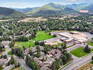Aerial perspective of suburban area featuring a mountainous background