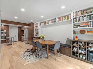 Dining area with large built banquet and shelves
