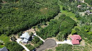 View of property location featuring a forest